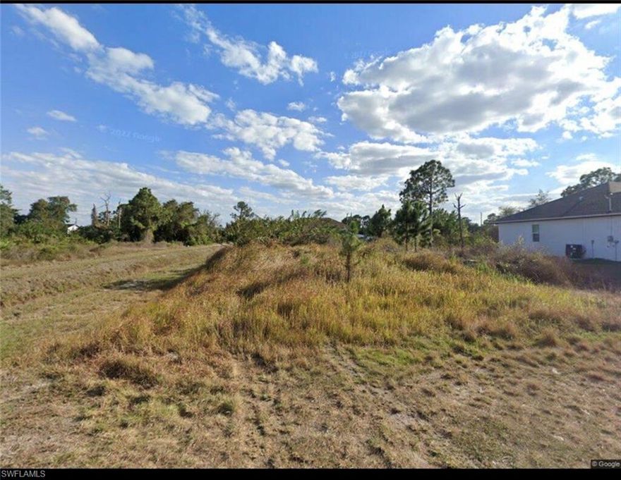 This CLEAN CORNER LOT  with dead end is not located in a wetland or flood zone, making it an excellent opportunity to build a primary residence or an income-producing rental property in the heart of Lehigh Acres, Southwest Florida. No HOA