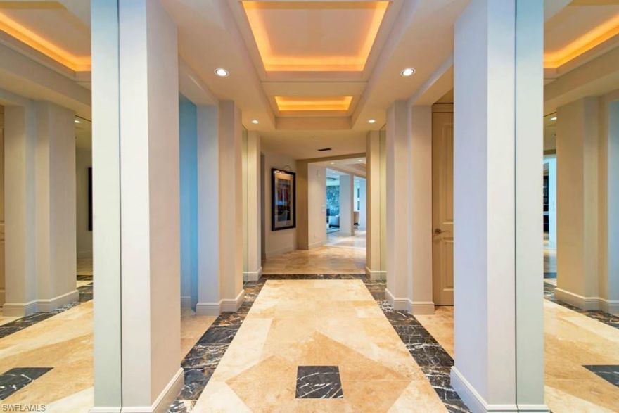 C.10196 - Incredible views day & night from this 6,000 sq. ft. Penthouse. Watch sunsets through the fabulous 23 ft. wall of windows facing the Gulf of Mexico & Estero Bay. Furniture was created to maximize the sunset experience. New professionally designed interior is sophisticated, yet warm & welcoming. All furniture is custom or high end. Entertain in the granite topped bar & living room complete with baby grand player piano & fire glass fireplace encased in granite. Coffered ceilings with adjustable ambient lighting in family room, living room, & hallways. Large kitchen features a gas range & huge butler’s pantry. Wine storage room near kitchen. Guest rooms located at one end of this single story penthouse allow for privacy of owners & guests. Each guest suite includes full bath & private balcony. Spacious owner's suite offers fabulous bay and gulf views & large finished walk in closets. Master bath includes his & her water closets. Private study located near owner's suite. This penthouse has been updated with state-of-the-art Wi-Fi boosters & sound system throughout including balconies. Storm shutters & private 2-car garage with air conditioned storage room.