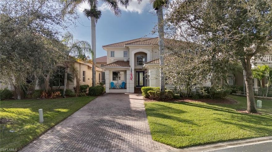 Home is where the palms trees sway and the children play....This large 4 Bedroom 3 Bath + Den home has a Loooong lake view & is being offered partially furnished (see exemption list). Enter from the open front porch and through a glass door front entry and you are welcomed by soaring vaulted ceilings with tile throughout the downstairs. There is a guest bedroom on the main floor with double glass french doors making it a great flex space or office area. The chefs kitchen has recessed lighting, large pantry, center island & breakfast bar finished off with wood panel cabinets, granite countertops with plenty of counter space, stainless Steel appliances with a glass cooktop & double wall oven. There is also a flex room off the kitchen which would make a great mud room but is currently used as a work/craft room. Head upstairs and you will discover wood vinyl flooring throughout in the guest bedrooms & loft area. There is a inside laundry room along with a screened back porch with a fenced yard for your 4 legged friends. Catalina Isles is a gated and pet friendly community that is centrally located to shopping, restaurants, entertainment and just a short drive to the beach. Accordion Hurricane shutters  & Impact Windows offer you storm protection - New Roof installed 2023. A/C installed in 2020. Water heater replaced in 2022. Amenities include a community pool, exercise room, playground, and clubhouse.  Come and see this well cared for home today!