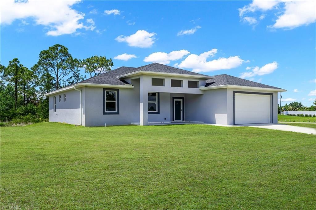Photo of 1905 Charles AVE N, LEHIGH ACRES, FL 33971 (MLS # 226016675)