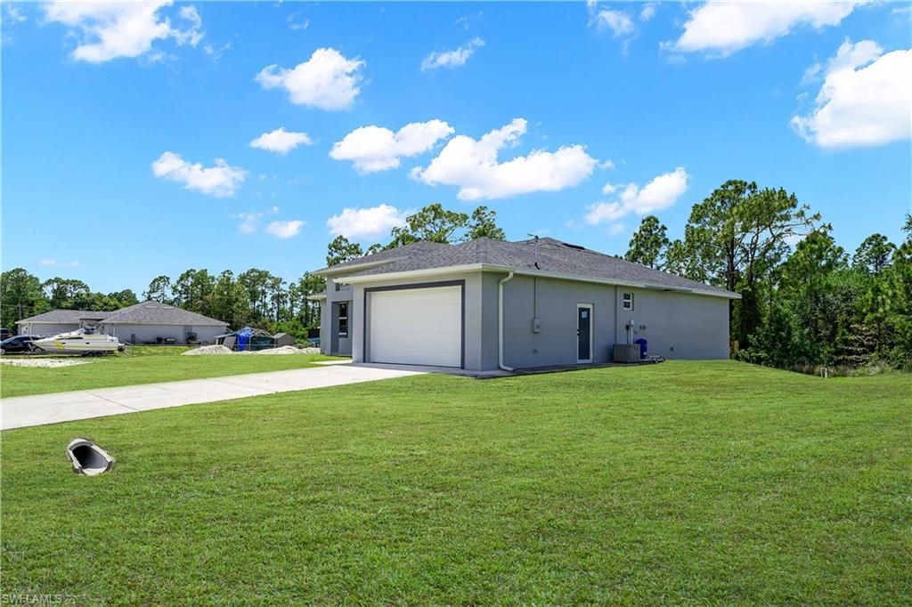 Photo of 1905 Charles AVE N, LEHIGH ACRES, FL 33971 (MLS # 226016675)