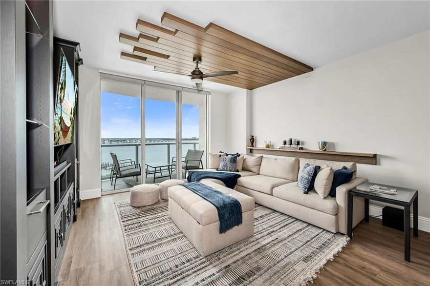 Enjoy sweeping views of the Caloosahatchee River and vibrant Fort Myers River District from this beautifully appointed three-bedroom, two-and-a-half-bath high-rise residence, where refined design meets effortless waterfront living. Thoughtfully designed to maximize natural light and panoramic vistas, the home features floor-to-ceiling impact windows and two expansive balconies that invite you to take in stunning sunrises, city lights and tranquil river views. The open-concept living space is elegant and inviting, seamlessly connecting the great room to the kitchen and dining areas, creating an ideal setting for everyday living and entertaining. Clean lines and sophisticated finishes define the interior, while recent updates, including a new HVAC system, modern appliances and custom-designed closets, enhance comfort and functionality. The gourmet kitchen is well-appointed with sleek cabinetry, premium hardware and refined design details, offering style and efficiency. The spacious primary suite serves as a private retreat, featuring serene water views and a spa-inspired bath designed with elevated finishes that bring a sense of relaxation to daily living. Guest bedrooms are equally impressive, offering generous space and beautiful views, ensuring comfort for family and visitors alike. Every detail of the residence has been curated to reflect a balance of luxury and livability. Residents enjoy access to an array of resort-style amenities within this striking, Miami-inspired high-rise, including a newly renovated pool and expansive sun deck, spa, state-of-the-art fitness center, sauna, tennis courts, business lounge, billiards room and full concierge services. The building has been meticulously maintained, with recent exterior painting and a newly updated roof, providing added peace of mind. Additional conveniences include a secure, dedicated garage parking space and a prime location in the heart of the downtown River District. Just moments away, you’ll find an exciting mix of waterfront dining, boutique shopping, art galleries and entertainment, offering a dynamic yet relaxed lifestyle. This exceptional residence presents a rare opportunity to enjoy elevated waterfront living with the best of downtown Fort Myers right at your doorstep.