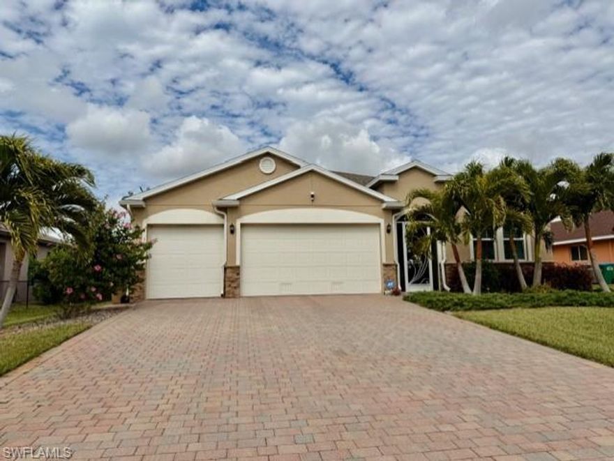Luxury Pool Living in the Prestigious Pelican Neighborhood of SW Cape Coral - with ALL ASSESSMENTS PAID & IMPACT WINDOWS.  This stunning newer construction residence is situated across from luxury canal homes and offers a wide-open floor plan with luxury finishes throughout, showcasing diagonal tile flooring across the entire home, kitchen island with granite and stylish backsplash with task lighting under 42-inch upper cabinets.  Designed for both elegant entertaining and everyday comfort, the home features 3 bedrooms plus a den with French Doors, 3 full baths, and a 3-car garage with paver driveway.  One owner took pride in upgrading and 

The expansive great room showcases a tray ceiling and opens seamlessly to a soothing waterfall feature in the heated salt-water pool creating your own private oasis.  The heart of the home includes a chef-inspired kitchen including stainless steel upgraded appliances, modern 42-inch upper cabinets and walk-in pantry.  Whether you're entertaining or just keeping it casual, this home allows several options with a dedicated formal dining area, a casual breakfast nook, spacious granite kitchen island or enjoy the outdoors in your screened lanai poolside.  This homeowner took great pride in upgrading stylish ceiling fans, lighting fixtures and custom drapery and automatic blinds.  Not only does this home have impact windows, but it also provides added peace of mind with electric storm shutter for the lanai.

Retreat to the luxurious primary suite sanctuary toward the rear of the home complete with a spa-like soaking tub, separate walk-in shower and dual vanity sinks.  The 2nd and 3rd bedrooms are located in the front of the home for added privacy and equipped with a full bathroom with custom walk-in shower and dual shower heads.  The den is located adjacent to the kitchen nook and is ideal for a home office, game room or additional guest room.  Step outside to your resort-style escape featuring a custom heated pool with sun shelf - perfect for lounging and embracing the Florida lifestyle.

Professional photography coming soon!