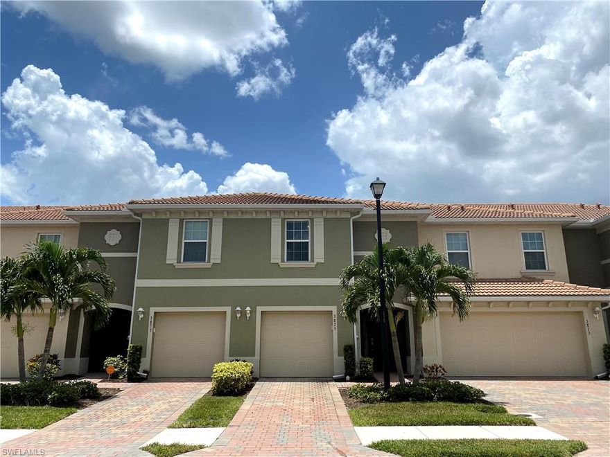 Move-in Ready and Sparkles Like New! Rarely lived in Ash Model featuring Twin large Master Suites with private full baths and Huge walk-in closets.  This gorgeous townhome's kitchen features stainless appliances, granite countertops, and 42" dark wood cabinets with crown molding. Flooring features include tile throughout the main floor and in wet areas upstairs. The front entry welcomes you with a paver driveway and entry that carries through with a paver lanai overlooking a stunning lakefront view. This floor plan features ample space and accommodation with half bath on the main floor to accommodate guests and a single car garage for storage.  This spacious townhome is located in a beautiful gated community of Lindsford showcasing multiple lakes and a large community pool. Enjoy the outdoors on the linear bike and jog paths that race throughout the neighborhood. All this PLUS affordable HOA fees at $138 per month Including lawn maintenance. Located in the heart of Ft Myers in the close to shopping dining with easy access to the airport and beaches. This is one buy you don't want to miss!