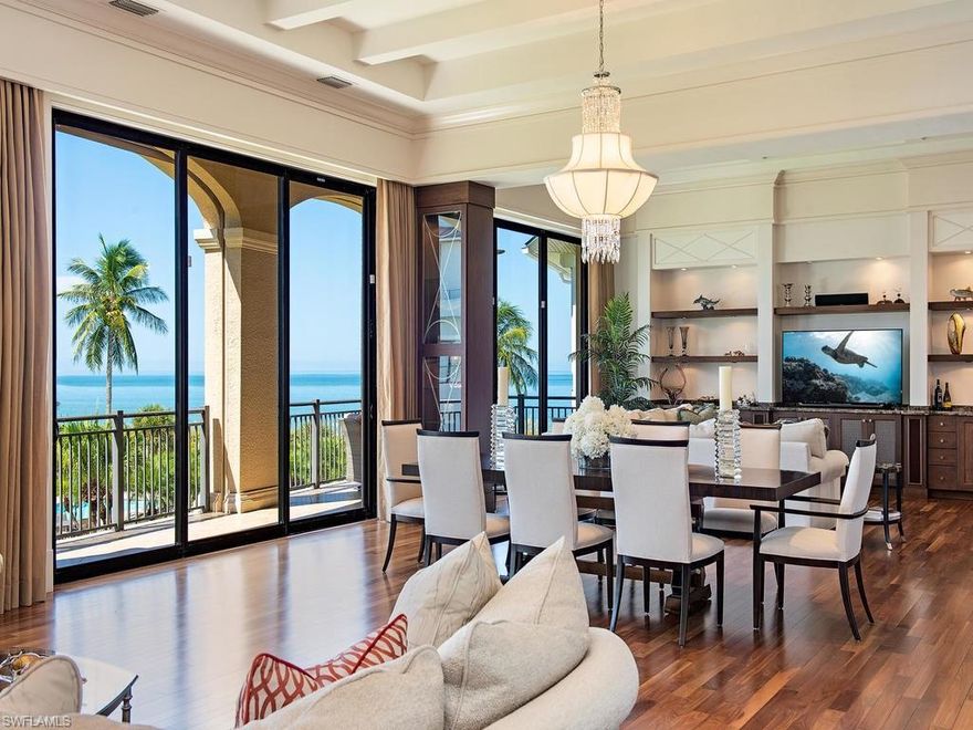 Fabulous 8800+ SF home in prestigious Barefoot Beach. No expense/feature was overlooked in  this 4 level masterpiece by McGarvey custom builders. Gulf views abound from multiple rooms and decks and beach access is only steps away via a private path through the garden and past the private pool shared by only 8 homes. Exquisite craftsmanship is apparent wherever you look; wood/marble/tile  floors, extensive millwork, chefs kitchen with double islands, custom cabinets, gas range and more.  A magnificent Great room concept combines living, dinning and casual family room all with floor to ceiling sliders with Gulf views. Open staircases of rich dark woods contrasted with white trim add drama to every level. Spacious guest suites spread over 3 levels with the entire 4th floor dedicated to the owners retreat with Spa Bath, Media room, large sundeck with glass railings, electric awning and amazing beach and Gulf views. The lower level includes entry foyer, large great room,  guest kitchen opening to private spacious theater,  guest bedroom and office. House includes elevator, multiple refrigeration options including wine tower, electric screens and shutters and 4 bay garage.