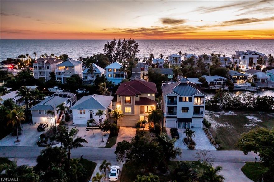 H5347- DIRECT GULF ACCESS w/ 5 MIN WALK TO THE BEACH......Masterful design & coastal contemporary are uniquely embodied in this luxurious multi-level home in Bonita Beach. Spanning over 7000 SF, this magnificent open floor plan residence has gulf views from multiple vantage points. The great room accompanied by a spacious dining area and large gourmet kitchen is the focal point of the main level. Entertain in style while guests spill out through the large glass sliding doors to the balcony overlooking the pool & spa below. Home features impact resistant doors + windows, entirely new upgraded pool screen (2021), private boat dock, massive outdoor living area on lower level, volume ceilings, custom wood cabinetry, granite counters, large island w/ breakfast bar seating and premium stainless steel appliances. The entire 2nd level is dedicated to (2) master suites, home office/den, laundry room and another screened balcony with awe-inspiring SW sunset views. Additional (2) private guest suites each boast en-suites and generous closets. Great beach house to enjoy waterfront living in
beautiful SWFL.