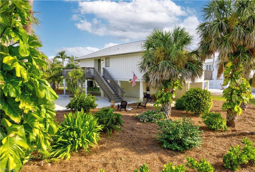 Lowest-Priced Single-Family Home on Captiva priced below market value – No HOA! Prime Village Location with partial Bay Views. TFC-2 Zoning offers creative options for future expansion ideas.

Don’t miss this coastal-inspired Captiva cottage, offering partial bay views and the best of island living with abundant outdoor space. This charming home features a screened-in porch, two large sun decks, undercover parking, and an entertainment area, perfect for enjoying the tropical lifestyle. With plenty of room to add a pool or spa, the possibilities for enhancing your outdoor oasis are endless.

Situated on a large 100 x 100 corner lot, this elevated island retreat is just steps from the bay and a short walk to Captiva’s pristine beaches, shops, galleries, and bistros. The spacious living area boasts vaulted ceilings, two bedrooms, and two baths, with newer plank tile flooring and a durable metal roof. The home's high and dry elevation ensured it did not flood or suffer storm damage, making it a resilient and secure investment.

This turnkey furnished home (with exceptions) offers excellent short-term vacation rental potential with weekly rentals allowed. There’s also an opportunity to add a second floor to maximize breathtaking bay views. Whether you're looking for a second home or a high-income rental property, this Captiva gem delivers both.

Survey and Elevation Certificate available. Schedule your private showing today!