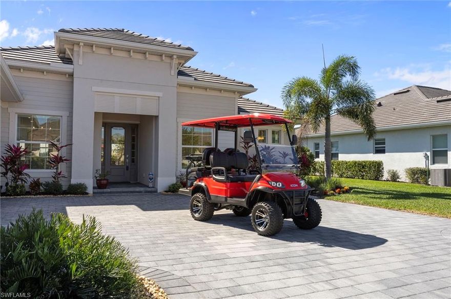 Turnkey living, endless sunsets and bundled golf await at this 2023 Napoli II estate home in the National Golf & Country Club at Ave Maria.  Offered fully furnished, it even comes with a brand-new golf cart — all you need are your clubs!  The split-bedroom floor plan provides 2,395 sqft with three bedrooms, a den and 2.5 baths.  An open-concept kitchen with over-sized island anchors the home and is equipped with high-end appliances and three refrigerators for entertaining.  A formal dining area and breakfast nook flow into the great room and out onto a screened lanai.

Set on a quiet cul-de-sac overlooking the 16th fairway, the residence enjoys southwest exposure and is just seconds from the Pro Shop.  The lanai hosts a heated pool and spa, an electric storm screen and a Blackstone and gas grill.  The owner’s suite features a huge walk-in closet and a spa-like bath with separate soaking tub and shower.  Plank tile floors, neutral palate, laundry room with sink, and cabana bath add comfort and practicality, while a surge protector on the electric panel safeguards your appliances & electronics.

The oversized three-car garage has space for your vehicles and the included golf cart.  Outside, pavered drives and manicured landscaping complete the curb appeal.  As part of the National Golf & Country Club, homeowners enjoy a Gordon Lewis–designed 18-hole championship golf course, with deeded membership included.  The resort campus offers a zero-entry pool, state-of-the-art fitness center with sauna, full-service spa, tennis and pickleball courts, and a clubhouse with indoor and outdoor dining.  Nearby Naples and the town center of Ave Maria expand your dining and shopping options.