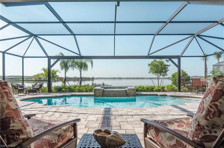 JUST REDUCED...This home on a prime location on the community’s largest lake demands attention. Barely lived in this home boasts 3 bed, den, 3 baths, pool, spa & a 3 car garage.  Details like vaulted ceilings and surround sound in great room, crown molding, upgraded lighting and window coverings throughout, hurricane impact windows & doors. Kitchen has upgraded cabinetry with Quartz counter-tops, Jenn Air refrigerator and Kitchen Aide dishwasher, cook top, microwave, oven & wine cooler.  Master suite has a large walk in shower with his and hers sinks & spacious walk in closet. Third guest bedroom has its own private bath. A Boat dock comes with this home so you can enjoy fishing, water-skiing, & sunsets. Lanai is pre-wired and plumbed for outdoor kitchen. Located at The Quarry, a Golf, Beach and Boating community with 1st class amenities offering over 500 acres of lakes allowing for boating and fishing. A spectacular golf course designed by Hurdzan-Fry. Combine that with a state of the art fitness center, resort pool, lap pool, beach club that has a 1/2 mile long sugar sand beach. Har-Tru surface tennis courts & more. Two full service restaurants & bar. Golf membership is optional.