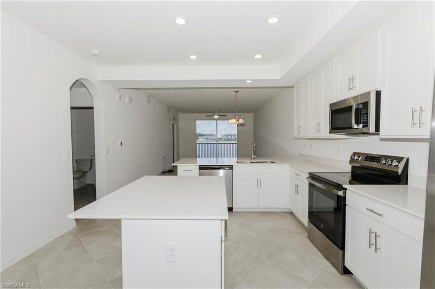 Beautiful Arbor floor plan in The National Golf and Country Club at Ave Maria – INCLUDING GOLF! This 2 bed, 2 bath condo offers 1,120 sq ft of open-concept living with a split floorplan for added privacy. Enjoy a bright kitchen, spacious living and dining areas, and a screened lanai perfect for relaxing or entertaining. Located in the Terrace Condominiums, residents enjoy resort-style amenities including a championship golf course, resort pool, fitness center, spa, tennis, pickleball, dining, and more. Set in the heart of Ave Maria, one of Southwest Florida’s fastest growing master planned communities, you'll enjoy a unique blend of small-town charm and modern convenience. Explore Ave Maria Town Center with its boutique shops, restaurants, community events, parks, and scenic walking trails. Experience maintenance-free living in a vibrant community.