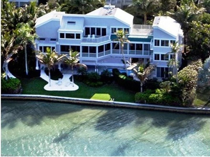 Exquisite luxury bayfront home with direct water access for a large boat. This stunning home features every upgrade imaginable including pristine bay views from nearly every room, 4 ensuite bedrooms, vaulted ceilings, 3 fireplaces, gourmet kitchen with granite, monogram GE refrigerator, 2-drawer Pakel dishwasher, Subzero wine cooler, beautiful wood cabinetry, breakfast bar, spacious master wing with jetted tub, rain shower/body jets, surround sound system, private study and generator. This home offers the utmost in privacy, superb landscaping, heated pool/spa, multiple sundecks, glass elevator, and a 3-car garage. New sundeck off master suite, 4 new air conditioning units in 2016 and new deck on dock in 2016.