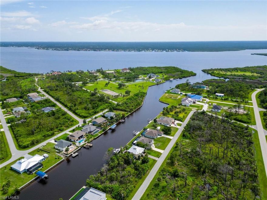 **** PRICE REDUCTION ****. One or more photo(s) has been virtually staged. Built in 2021 by Adams Homes and loaded with upgrades from front to back, this 4 bed, 3 bath stunner is perfectly set up for the boating lifestyle you’ve been dreaming of. Sitting on a canal with direct access to the Myakka River and open Gulf waters, the home’s rear faces northwest, while the front faces southeast — making for ideal sunrise coffee views and sunset poolside vibes. It comes complete with a $35,000 private boat dock and 10,000 lb lift, giving you waterway freedom right from your backyard — no pesky HOA telling you otherwise. Inside, you'll find a split floor plan with a flex room, tray ceilings, $20,000 in upgraded flooring (no carpet!), and a $6,000 water softener system already installed. Step outside to your $100,000 outdoor oasis featuring a 2-year-old screened-in saltwater heated pool /spa and lanai, plus a fully plumbed covered outdoor kitchen, with a covered seating area with a wall mounted TV — perfect for entertaining or unwinding Florida-style. With its decorative tile roof, lush landscaping, and slightly elevated position, this home brings serious curb appeal and has stayed high and dry during recent storms despite being in a flood zone — no flooding or storm damage here. Whether you're a weekend boater, serious angler, or just want to live the salt life — this home checks all the boxes. Opportunities like this on the waterway don’t come around often. Claim your piece of the Florida lifestyle — before someone else does.