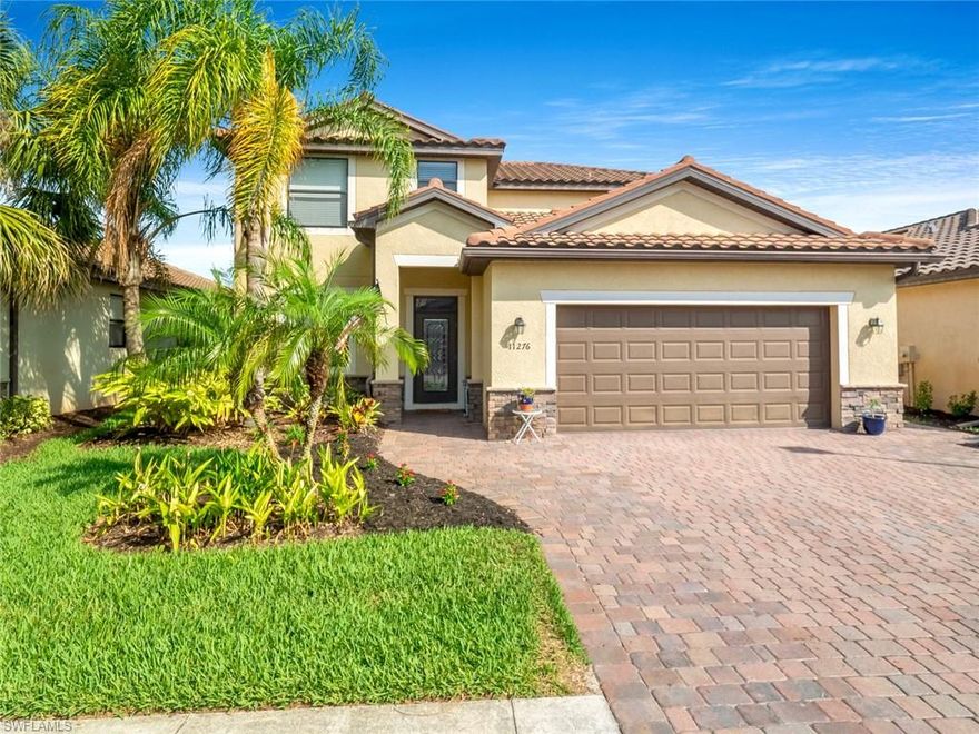 This spacious Amalfi model welcomes you with a perfect, inviting and comfortable vibe for your family!! Enjoy beautiful water views and gorgeous sunsets from your lanai that is perfect for entertaining+relaxation! Over 2600 quality square feet offering an expanded driveway, crown molding, upgraded tile throughout the downstairs living areas with granite countertops in kitchen and bathrooms, wooden cabinetry, walk-in closets, built-in work bench and much more. This 4 bedroom/loft floor plan is perfect for somebody looking for space with 3 bedrooms and a spacious Loft upstairs that can be used as a home office, home school space or bonus family room.  A private suite downstairs that is perfect for your guests. You won't believe all that you get for the money until you come and view this gorgeous home!   Reflection Isles, a quiet, gated community in the Daniels and Palomino corridor, bordering the 2,000 acre Six Mile Cypress Slough Preserve and close to Southern Fresh Farms! Close to shopping, dining and airport. Four miles from Red Sox and Twins baseball spring training stadiums! There is a large community pool, fitness center, tot lot, basketball court, sidewalks, and tennis courts.