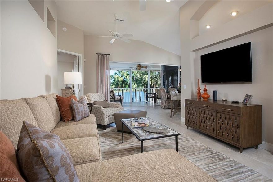 This is for the location buyer who wants a picturesque lake and golf view. It is easy to celebrate life in this light, bright and impeccably maintained condominium with new transitional renovations. This home has three bedrooms, two baths, fabulous lanai and great-room plan. This exceptional unit features bamboo flooring in bedrooms, plantation shutters, designer tile in living areas, new carpet on stairway, HVAC replaced in 2015, water heater in 2016, electric HURRICANE shutters on lanai, remodeled guest bathroom, closet system in master bedroom, built-in entertainment center in bonus room, painted garage floor, bike holders, storage shelves and so much more!  Enjoy views of the 12th fairway of Shadow Wood north course. The Shadow Wood Country Club community also provides 54 holes of golf, a fitness center, Har-Tru tennis courts, lap pool, private beach club, pickleball, The Rookery restaurant, trails and a great location.