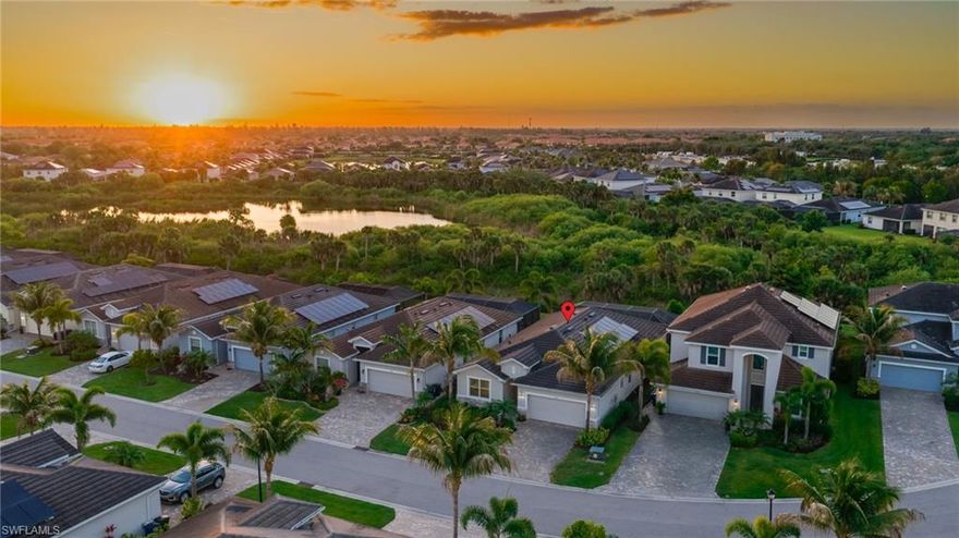 Shows like a model - perfectly maintained! Turnkey furnished and decorated! Experience luxury, privacy, and the ultimate Florida lifestyle at 9746 Mirada Blvd, located in a quiet gated community just 10 minutes from Fort Myers Beach and Sanibel Island, and never impacted by any flooding. This elegant Marsala floor plan features a wide open concept layout with three bedrooms plus a den, three full bathrooms, a massive island kitchen, spacious covered lanai, paver pool deck, heated pool and spa, and screen cage. The protected natural preserve behind is home to bald eagles, ospreys, hawks, and seasonal white pelicans and roseate spoonbills. The upgraded kitchen faces the back of the home, offering incredible views and easy monitoring of kids in the pool. The master suite is a true retreat, offering a large bedroom, two walk-in closets, and a luxurious bathroom with dual sinks, a soaking tub, and a walk-in glass-enclosed shower. Outside, enjoy a 24'x9' covered lanai, a 40' wide screened pool deck, and a heated pool with a waterfall spa, all overlooking the preserve. Notable features include porcelain plank tile flooring, upgraded countertops, solid wood shaker style cabinetry, crown molding, custom paint, reverse osmosis water filtration system, generator switch, whole home surge protection, and more. Mirada shares an energy grid with the neighboring Health Park Hospital, so power rarely goes out, and is restored quickly if it does. Solar panels on the roof are leased maintenance-free and provide average electric bill savings of $120+ per month. Within minutes, you'll find an endless selection of beaches, shopping, dining, entertainment, and grocery stores. Don't miss your chance to live the dream Florida lifestyle, schedule your private showing today.