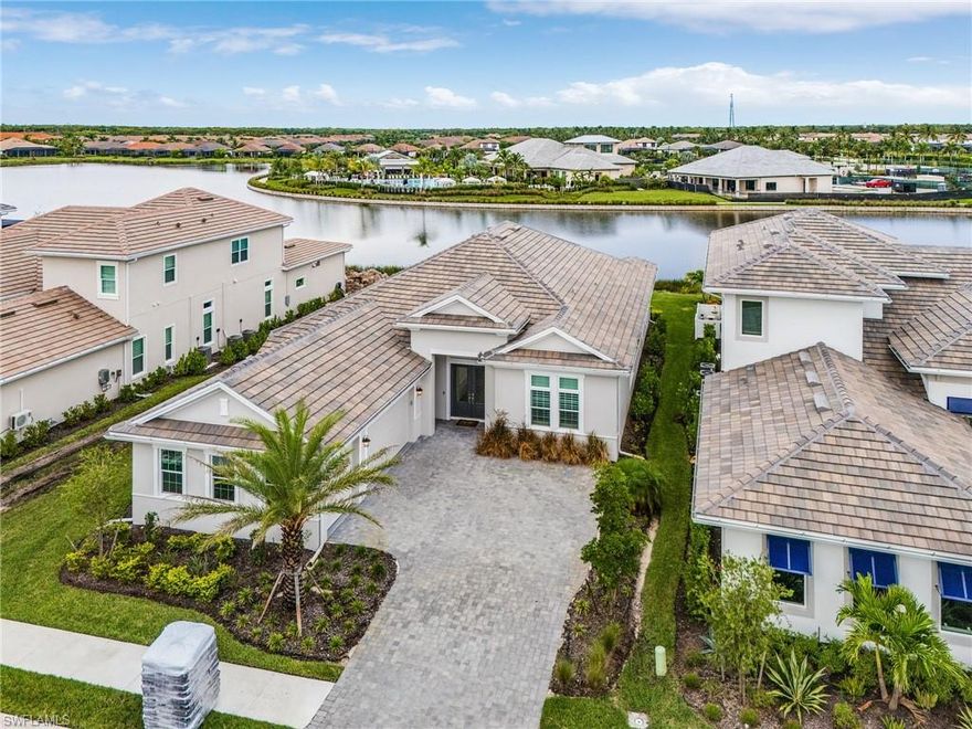 "Huge Pickleball Community"if you love Pickleball Here is your opportunity to purchase a Huge 3 car garage Lincoln model/ floor plan on a 76 wide lot great for plenty of room for the CUSTOM POOL you always wanted in the highly sought after community of Esplanade by the Islands on the largest lake in the community is now available! Enjoy your coffee every morning while you enjoy the sunrise over the water on your extended Lanai with plenty of space to add a pool/spa. A pool bath was built and is ready to go with pool and spa of your design choice. The interior of the home offers 12 foot ceilings to include trays in the great room, master bedroom, dinning room and foyer, level 5 upgraded cabinets and an open concept for the chef in the family. 3 bedrooms, large den, 3.5 bathrooms and 3 car garage. Amenities include a resort style pool, spa, wellness center, 8 PICKLE ball courts, 5 TENNIS courts, 4 BOCCE courts, Bahama bar and restaurant poolside, fine dinning restaurant currently being built. its a short drive to downtown Naples and Marco Island beaches.