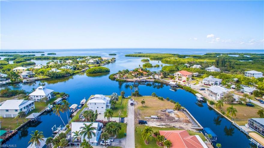 THE ONLY TIP LOT AVAILABLE IN PIRATE HARBOR!! PLUS SEAWALL ALREADY INSTALLED!   One of the nicest building lots in southwest Florida, with amazingly quick access to Charlotte Harbor and the Gulf of Mexico with no bridges. Potential for a harbor view from 2nd story of your new home!   Close proximity to downtown Punta Gorda and all it has to offer, including shopping, dining, parks and trails. Just a short distance to Punta Gorda or Cape Coral.   Enjoy world class fishing from your back door and the beautiful beaches of southwest Florida just a short boat ride away. Public water and sewer are available. Convenient to Punta Gorda Airport and Southwest Florida International Airport. Great time to build your dream home!