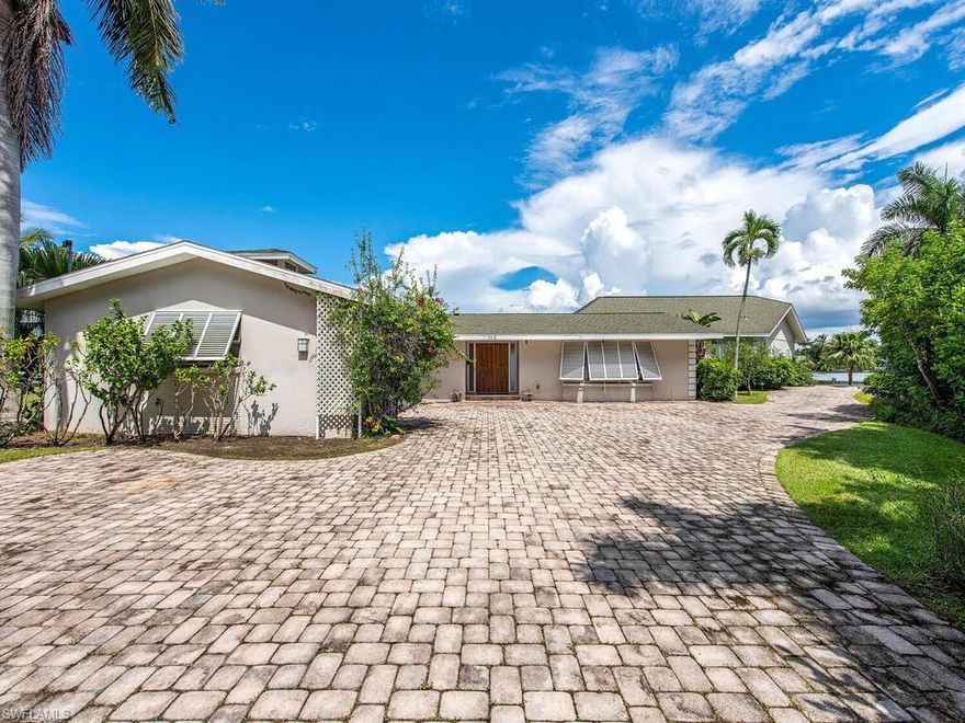 Live the life of your dreams in this boater's paradise community! Situated on a generous 0.40 acre bay front lot, this home is ready for your reimagining. With 290' of water frontage overlooking the bay on this private, end-of-road location, this property offers an incredible opportunity to visualize and build your new residence. Located in pristine Aqualane Shores, the community features spectacular waterfront estates and is ideal for boaters who appreciate the deep wide-water canals that allow docking directly on the property. Deep water, no-bridge access to the Gulf of Mexico is what has made Aqualane Shores a true destination for avid boaters. Outdoor enthusiasts will enjoy the ample opportunities for walking, running, cycling and the nearby white sands of Naples beaches only a stone's throw away. Aqualane Shores is in the heart of it all with the 3rd Street South shopping district and its wonderful restaurants and shopping mere steps away.