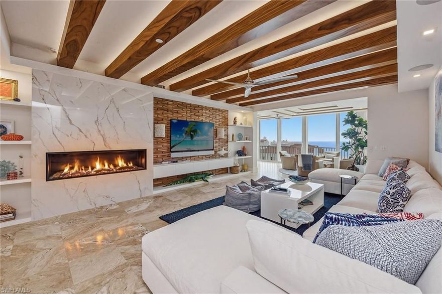 Professionally decorated and masterfully re-imagined by DK Brown, this eighth-floor coastal residence is jaw-dropping from the moment you walk in. Completely renovated with an elevated design vision, the condominium showcases sweeping beach, Gulf and bay views at every turn. Travertine and wood flooring, beamed ceilings, a custom fireplace, with front and rear lanais create an atmosphere of refined luxury. From sunrise to sunset, this home ensures you never miss a moment of the breathtaking scenery. 
The chef-inspired kitchen is an entertainer’s dream, featuring quartz countertops, an oversized eat-in dining area with seating for ten, a large wine cooler and a spacious coffee bar, all overlooking the serene morning vistas of Collier Bay.
 The front guest suite is a sanctuary, offering incredible Collier Bay views and its generous sitting room. A spa-like bath with an oversized closet and beautifully curated finishes completes the space, delivering a peaceful, Zen-inspired retreat for your guests. 
Wake up each morning to the soothing sound of waves in the stunning primary suite, where expansive Gulf and beach views greet you the moment you open your eyes. Go directly onto the Gulf-side lanai and savor sunsets that feel close enough to touch, this is a sanctuary. The main bath has been completely re-invented, featuring a spacious open closet designed to accommodate dual wardrobes, along with a beautifully appointed bath offering tranquil water views. A den has been thoughtfully added to provide a comfortable office or reading space. The third bedroom is equally impressive, featuring charming nautical windows overlooking the beach terrace, an unforgettable coastal touch.  Complete with Control 4 system for smart home automation for audio, video, climate control and blinds! It just doesn't get any better! 
 Don’t miss this absolutely breathtaking, one-of-a-kind coastal residence, an extraordinary blend of luxury, design and panoramic water views. In Prestigious Hideaway Beach, the community on the Gulf with world-class amenities. Features an incredible clubhouse on the beach with several dining venues, new state-of-the-art fitness center, golf, tennis, pickleball, bocce ball and more! Enjoy the lifestyle you have been waiting for!