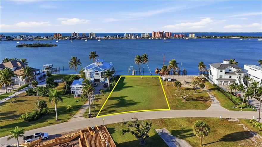 PRIME 1/2 ACRE OF BAYFRONT on San Carlos Island presents an extraordinary luxury opportunity—one of the most impressive and substantial parcels (20,830 sq ft ) available in all of Southwest Florida. Impressive 100 feet of BAY FRONTAGE. Paired with an approximate depth of 215 feet, the property offers a rare level of scale, water frontage, and design freedom that is virtually unmatched in today’s market. Perfectly positioned with western exposure, the homesite captures unforgettable sunset views while overlooking a deep-water canal that provides quick, unobstructed access to the Gulf of Mexico. This extraordinary blend—sunset vistas and premier navigable water—sets the stage for an unparalleled coastal estate. A newer dock, thoughtfully configured to support two boat lifts, is already in place, allowing your waterfront lifestyle to begin from day one.

San Carlos Island is rapidly ascending as the next elite hot spot in Southwest Florida, drawing sophisticated homeowners, investors, and luxury builders. The setting is exceptional: enjoy a short stroll to Fort Myers Beach’s iconic waterfront restaurants, or take a scenic walk over the bridge to the world-famous Margaritaville Resort and the pristine beaches of Fort Myers Beach. Yet, unlike true island properties, this location offers zero winter traffic congestion, providing effortless access to Sanibel, Captiva, Bonita Springs, Naples, and RSW International Airport.

This rare combination of size, deep-water access, walkability, and convenience makes 948 San Carlos Blvd an unmatched canvas for your vision. Design a world-class coastal estate with room for expansive indoor-outdoor living, or leverage the area’s no rental restrictions to create a high-yield luxury rental asset in one of the region’s fastest-growing waterfront markets.

Half an acre of wide-water frontage, unrivaled Gulf access, sunset views, and premier proximity to Fort Myers Beach—opportunities of this caliber are exceedingly rare. Build your masterpiece, elevate your investment strategy, and secure your place in the future of San Carlos Island.