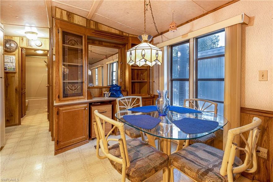 Price reduced!  This little place is located on a BEAUTIFUL corner lot in the gate, 55+ community of Imperial Wilderness.  It has an open Lanai ready for your special touch.  It also has a nice sized storage room. The kitchen/dining area is quite open which makes it seem bigger than it is. At this price it is certainly worth a look. Close to many stores. Eight miles to Marco Island, 12 to downtown Naples, 2 1/2 to CVS or Walgreens, 3 to Walmart.