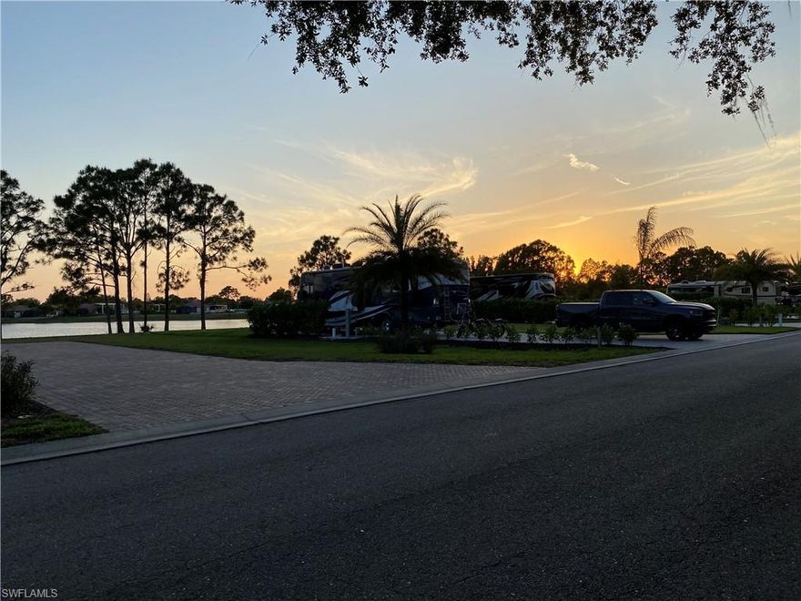 We have a Gem of a property for you here! This beautifully landscaped Lakefront RV Lot could be your very own Piece of Paradise. You will be greeted with the morning sunrise and end your glorious day with a stunning SWFL sunset. There is plenty of space to park Stacker trailers (painted to match the coach) or additional vehicles, right on your own paver pad. The RV lot is over 6,000sq ft allowing for a coach cabana, outdoor kitchen, and/or pool to be built now or in the future. You will also enjoy access to a stunning clubhouse, catering kitchen, outdoor grills, saltwater pool, hot tub, sauna, and exercise room. There are plenty of activities for everyone and every interest including pickleball, cornhole, fishing pier, kayaks, paddleboats, darts, poker, board games, books, puzzles, dog park, and outdoor wood burning firepit. The Resort is only a short drive away from restaurants, shopping, parks, golf, airport, Baseball Spring Training Stadiums, and SWFL Beaches. Golden Palms Luxury Motorcoach Resort is a Fabulous place for your Class A or Super C Motorcoach for "Season" or as a "Home" base. Welcome Home!