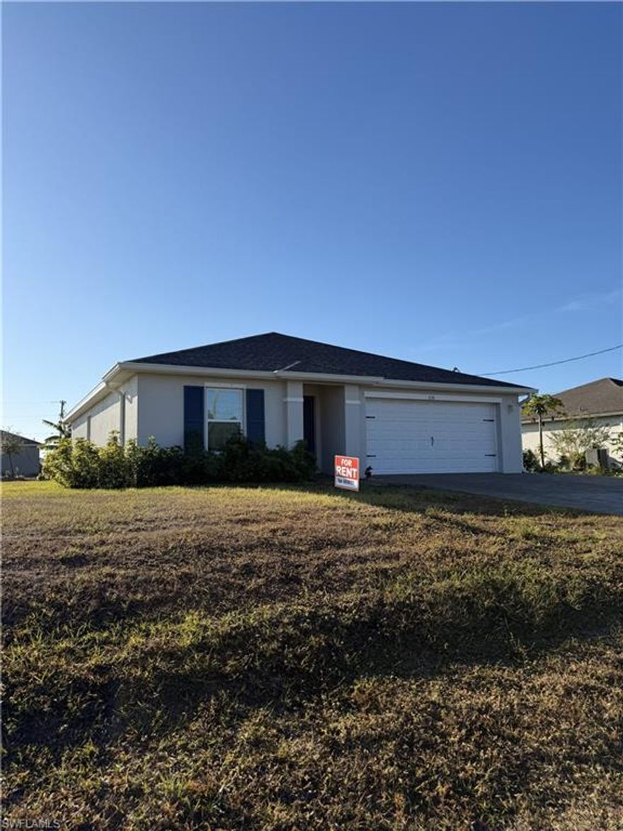 Available now. Modern 3-bedroom, 2-bath home offering the comfort of newer construction without the wait.
Built in 2023, this property features impact-resistant construction, city utilities, and a clean, contemporary design with durable tile flooring throughout the main living areas.

The open-concept layout creates an inviting living space filled with natural light. The kitchen stands out with quartz countertops, white shaker-style cabinetry, stainless steel appliances, and a spacious breakfast bar overlooking the living and dining areas — ideal for both everyday living and entertaining.

The primary suite offers privacy and generous space, while two additional bedrooms provide flexibility for guests, family, or remote work.

Additional highlights:
• Indoor laundry room with washer and dryer included
• Two-car garage
• Paver driveway
• Neutral finishes throughout
• Move-in ready condition

Located in a growing Cape Coral neighborhood with convenient access to schools, shopping, dining, and major roadways.

Immediate occupancy available.
First month and security deposit required.
Background and credit screening apply.