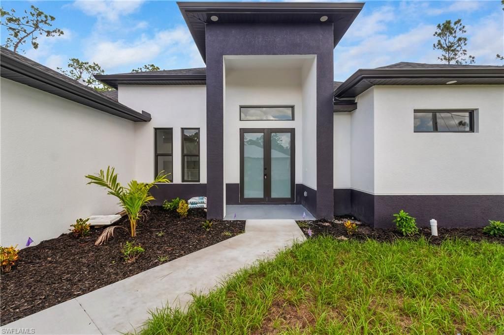 Photo of 1310 Acacia AVE, LEHIGH ACRES, FL 33972 (MLS # 2025017896)