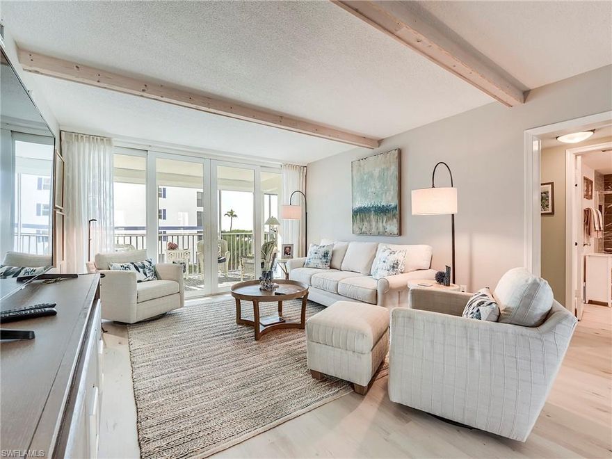 Island Reef offers an exceptional opportunity for refined beachfront living, now available move-in ready. Ideally positioned just two residences from the sand, this beautifully appointed coastal retreat enjoys sweeping Gulf and beach views from every window and sliding door—including both bedroom suites. This desirable split two-bedroom, two-bath layout was designer-renovated in 2020, blending timeless coastal elegance with today’s modern luxury.

The sophisticated living space is highlighted by a dramatic wood-beamed ceiling and flows effortlessly into the open dining area, where twin impact windows frame tranquil water views and flood the home with natural light. Three sets of sliders lead to a screened lanai, creating a seamless indoor-outdoor living experience with serene pool, beach, and Gulf vistas—perfect for enjoying brilliant sunsets year-round.

Luxury upgrades include impact-rated windows and sliders, motorized hurricane shutters, no storm damage, and luxury vinyl flooring with five-inch baseboards throughout. The chef-inspired kitchen has been fully reimagined with quartz countertops, stainless steel appliances, and an impact window—an ideal setting for morning coffee while overlooking the crescent beach and shimmering Gulf waters toward Sanibel.

Additional features include a full-size walk-in laundry room with custom closet systems, updated HVAC, and a newer hot water heater. Direct access to a scenic beachfront walkway offers effortless enjoyment of breathtaking coastal views and unforgettable sunsets.

Island Reef is a pet-friendly community with no size restrictions, welcomes monthly rentals, and features a geothermal-heated beachfront pool. Ideally located directly across from Santini Plaza with shopping, dining, marina access, and a trolley stop, this residence delivers the ultimate in luxury, convenience, and coastal lifestyle.

A rare opportunity to own an elegant, pet-friendly beach retreat in one of Fort Myers Beach’s most desirable communities.