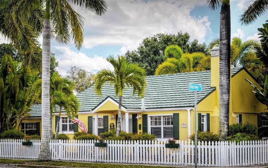 ** OPPORTUNITY ALERT! ** This is your chance to own a piece of Punta Gorda History with this unique and well-known property in the heart of Punta Gorda’s historic district. Situated in a classic tropical setting, at the corner of Harvey Street and West Olympia Avenue, is where you’ll find the long admired and meticulously maintained “Pineapple House.” Familiar to most, this absolutely adorable and TURN-KEY FURNISHED residence sports an efficient great room design with approximately 1100 square feet of living space, including two spacious bedrooms, a full bath, an open and updated kitchen with newer appliances and granite counters, a built-in desk and pantry area, a single car attached garage, plus a one-car carport, both with alley access and a 13x12 foot covered and screened lanai. The home has a beautiful green metal roof, complete window storm protection, a built-in electric fireplace, crown moldings, tile flooring throughout and a new (2022) air conditioning system. From this amazing central location, you are just a few minutes away from all that historic downtown Punta Gorda has to offer.  Take your VIRTUAL tour now with THE 3D INTERACTIVE TOUR ASSOCIATED WITH THIS LISTING.
