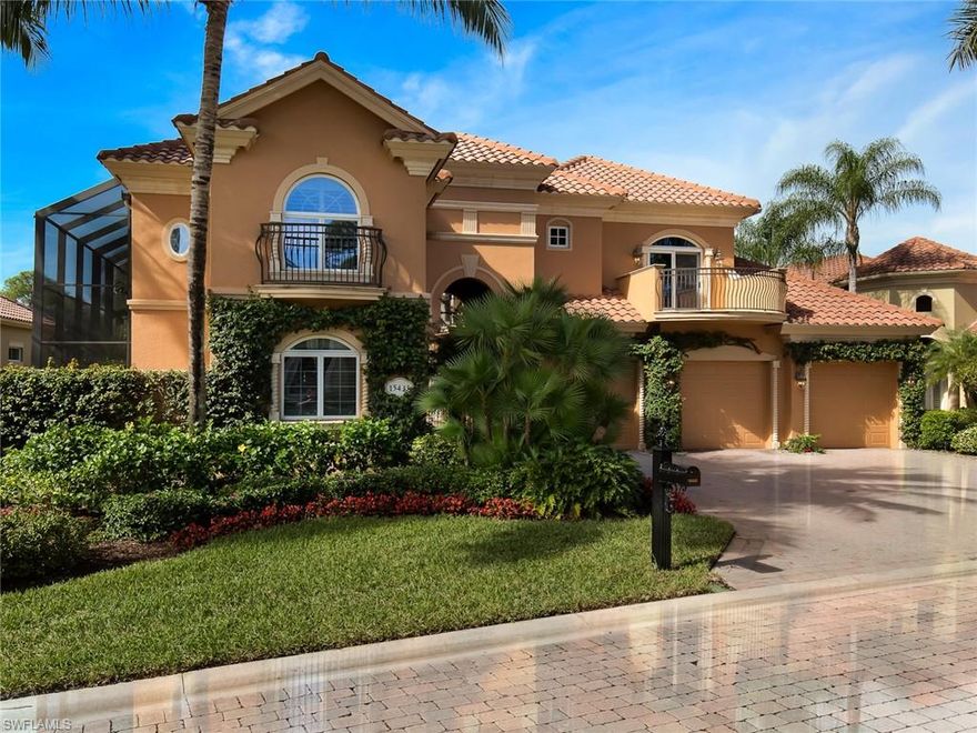 THREE CAR GARAGE. Tremendous two-story villa features a separate guest cabana in the courtyard pool area boasting a spill over spa with a tranquil rock waterfall feature. An abundance of custom appointments throughout include volume ceilings with cathedral design and exposed wood detail, extensive windows, glass sliders and doors, built-in display shelving, built in media center, a wine bar service area with a sink, lush carpet, wood and marble flooring. The second floor is complete with a loft gathering area with a built-in desk, built in display and storage features along with french doors opening to a private open air balcony. Enjoy outdoor living and entertaining in the screened and covered spaces including the covered summer kitchen with an exceptional al fresco dining area alongside. and a separate screened loggia along the back of the residence boasting long sparkling lake views. VIEWS, VIEWS, VIEWS