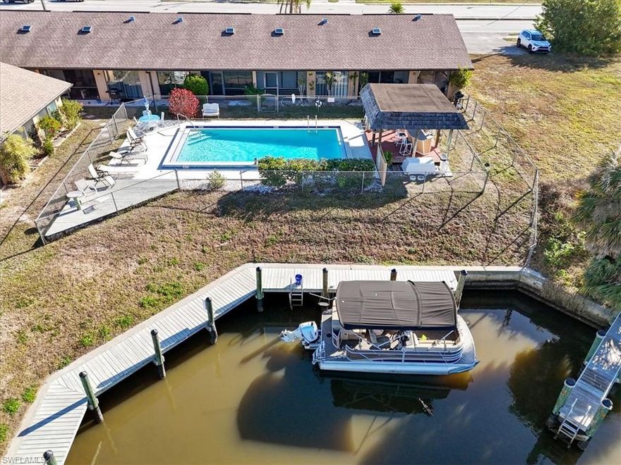 This newly updated two-bedroom, two-bathroom condominium offers an exceptional waterfront lifestyle with direct Gulf access via a serene canal. Thoughtfully designed, the residence features a bright and open floor plan that maximizes natural light and creates a seamless flow between living and dining areas. The updated kitchen and bathrooms showcase modern finishes, while spacious bedrooms provide comfort and privacy. Step outside to the backyard and enjoy peaceful canal views with the community pool conveniently located just beyond, creating an ideal setting for relaxation and outdoor enjoyment. Situated in a well-maintained community, this condo is ideally located near a variety of restaurants, supermarkets, and everyday conveniences, offering both tranquility and accessibility in a desirable coastal setting.