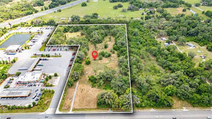 Positioned directly off Interstate 75 at Exit 314, this 15.25-acre industrial-zoned development site offers a rare opportunity to secure land in one of Central Florida’s fastest-growing corridors: The Villages, where infrastructure, logistics, and population growth are converging in real time.

With 65,000+ vehicles per day (AADT) and immediate proximity to national operators including Love’s Travel Stop, this site delivers visibility, access, and scale.

The property offers access to public sewer, providing a key infrastructure advantage. While water and electric services are not currently connected, nearby availability creates flexibility for a wide range of commercial or mixed-use concepts.