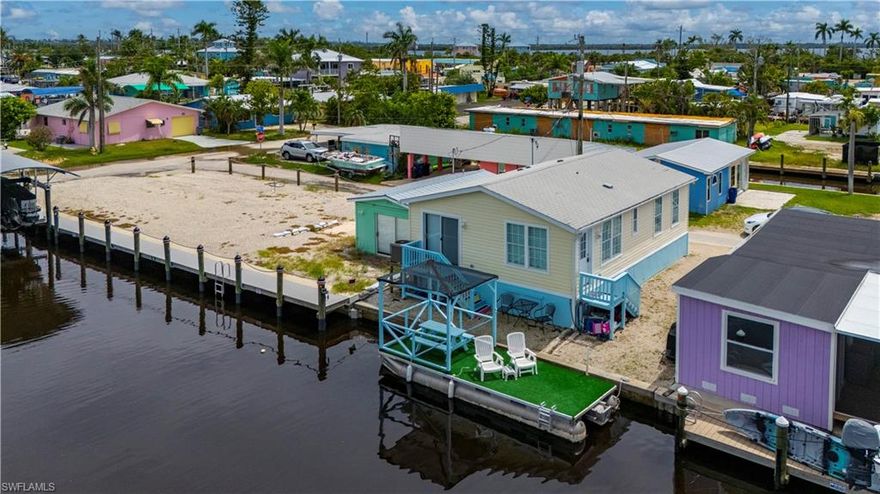 REDUCED $25K! NO FLOODING from any previous hurricanes! **OWNER financing available** This ELEVATED Gulf-Access home built in 2018 is a proven TURNKEY furnished short-term rental with 200+ Airbnb reviews rated 4.99 stars. ~$20,000+ in Rental Income so far in 2026! Enjoy wide water views, a large floating dock with shade and seating, and room to park your boat or install a dock & lift. Inside, you’ll find 2 bedrooms, 2 bathrooms, vaulted ceilings, stainless steel appliances, and stylish updates throughout. Located in the heart of Matlacha, you’re steps from popular restaurants and shops, with easy access to the ferry to Boca Grande, Cayo Costa, Captiva & more. The Great Calusa Blueway Kayak Trail (200 miles) and endless boating, fishing, and kayaking adventures are right at your doorstep. This is one of Matlacha’s most desirable homes — schedule your showing today!
