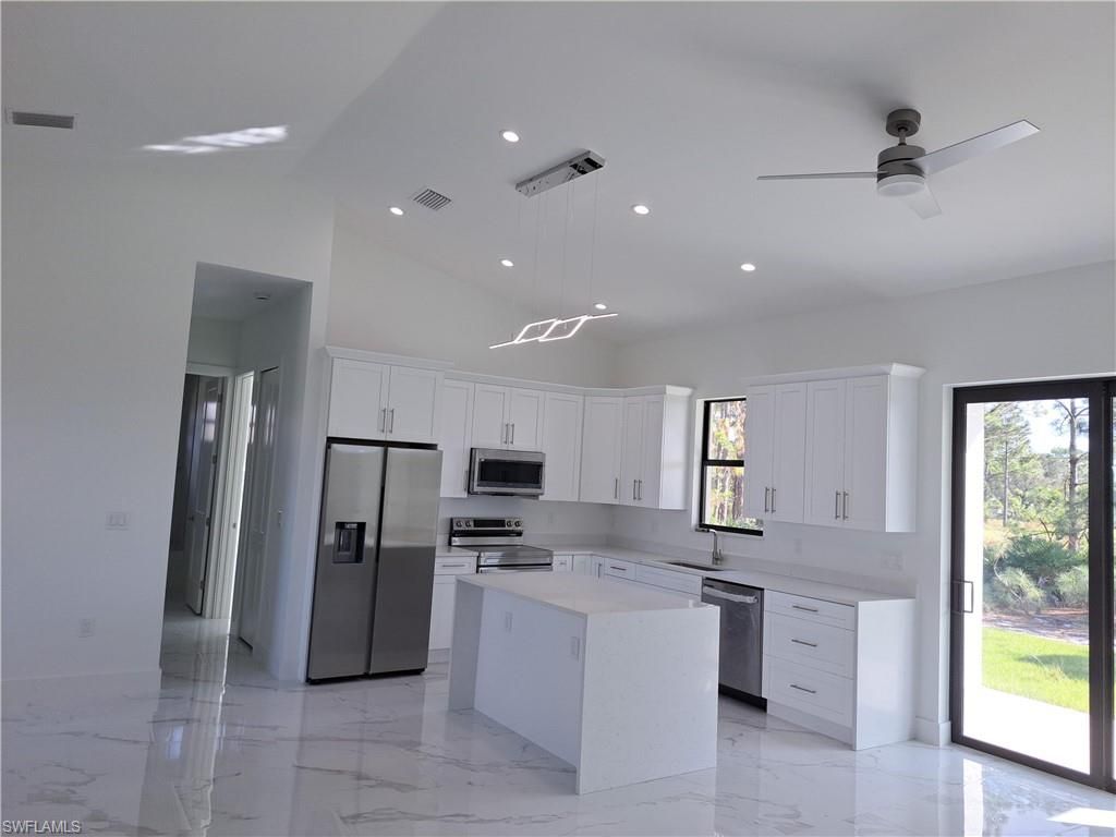 Photo of 2915 28th ST SW, LEHIGH ACRES, FL 33976 (MLS # 226013285)