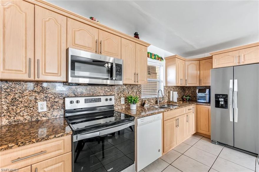 NO HOA!!! Explore the endless possibilities of this oversized corner lot home with two seperate, double-car driveways and potential rental opportunity with a private entrance in-law suite. Come see this wonderful 4-bedroom, 3-bathroom home located in a quiet area in Golden Gate City. Open floor plan living/dining area, spacious kitchen with granite countertops and laundry in residence. The kitchen has plenty of cabinets space. Appliances including washer, dryer, refrigerator, stove and microwave were updated in 2024. Interior of home has been freshly painted in the last year. Home is flood zone "X" and lenders will NOT require flood insurance. This property is located close to schools, banks, restaurants, shopping centers, I-75. Don't wait, schedule your showing today!