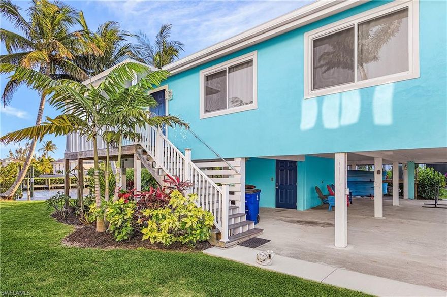 Welcome to this beautiful 3/2 completely updated costal home.  The owners have added lots of extras since their purchase in 2024.  All windows and sliders were upgraded to Impact Resistant.  All appliances were replaced, washer, dryer, refrigerator, microwave and dishwasher.  All bathrooms were renovated with new shower, tub, vanity,  sink and fixtures.  The vinyl siding was replaced with a stucco finish to update the exterior look.  The entire house inside and out, including the shed for storage was painted.  The upstairs balcony is now screened in for year round enjoyment. All boat and home decking is composite and a boat lift cover was added.    A new septic and drain field was completed.   The owners redid the landscaping and planted over 15 fruit trees. (the list is in the addendums) New roof installed in 2023.  A/C was replaced 2022.  Extended driveway with room for lots of cars, boat trailers or RV. Direct gulf access, over 70 feet of wide canal frontage, and an existing dock with a boat lift (boat lift capacity 10k with 12.6 beam and extra piling for future second boat lift.  Come see this updated beauty.  Whether used for weekend getaways and rentals or a relaxing year round island lifestyle, this home has it all.  Pine Island, Bokeelia and St James City are the best places for boating, fishing, beaching and shelling.