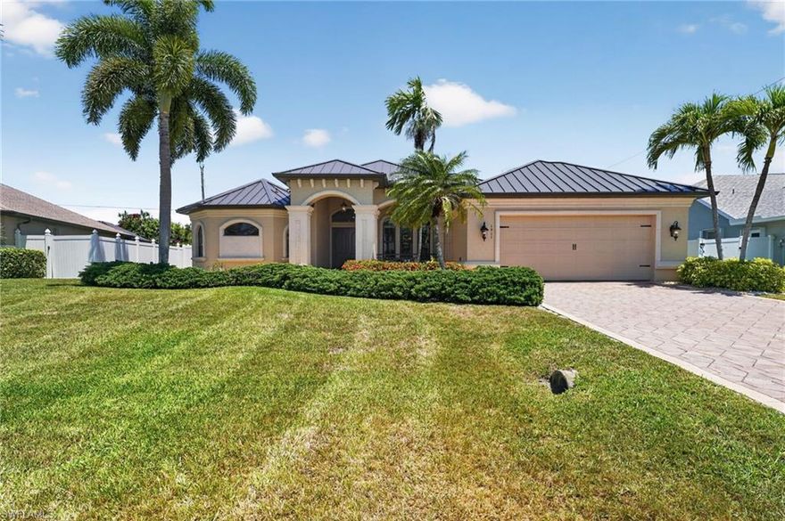 High-end construction in desirable Cape Coral! This 4 bed, 2.5 bath home offers 2,775 sq ft with a private pool and spa. Enjoy peace of mind with a generator hookup, standing seam metal roof, and high-impact doors and windows. High-end touches include plantation shutters, 10’ ceilings, 8’ solid core doors, and crown molding throughout. Spacious primary suite with dual California closets. Quality craftsmanship and upscale finishes throughout. High-end construction for less than $300 per sq ft—don’t miss this opportunity!