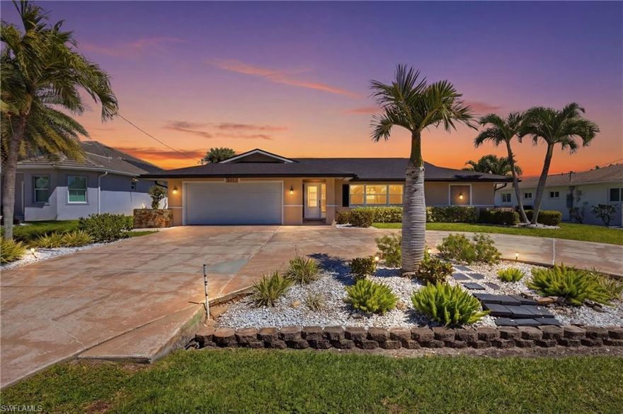 Discover exceptional value in the highly sought-after Palaco Grande neighborhood. This home is priced to sell and offers the ultimate Florida boating lifestyle. NO BRIDGES means you'll enjoy quick, unrestricted boating access to the Gulf right from your backyard! This home features impact windows, a new roof (2023), newer AC, and resurfaced pool, giving peace of mind and move in ready convenience.  Owners carry a transferable flood policy. Inside, you will find over 1900 sqft under air, updated kitchen with large custom picture window that includes hurricane protection. Step outside to a large covered outdoor space for all of your poolside entertaining! Located in an established neighborhood, this home is just minutes from shopping, dining, and some of Southwest Florida's most beautiful beaches!