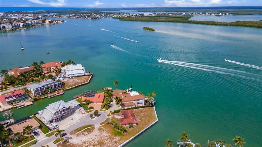 First time offered on the market; this property has been long cherished by an original owner who purchased directly from Deltona Corporation nearly 50 years ago. Here's your chance to own 175ft of deep, direct access river frontage on one of the most desirable locations and highly sought-after streets on Marco Island.
$6 million+ dollar estates are being constructed in the neighborhood. Discover the ultimate island lifestyle with stunning panoramic water views and crystal-clear emerald waters. Immerse yourself in the tranquility of this serene paradise with an abundance of bird watching, wildlife, dolphins, manatees and yachts cruise past this once in a lifetime location. Overlooking the Marco Island River, Stingaree Island and the iconic Jolley Bridge, this 0.28-acre lot is a rare opportunity to capture the essence of waterfront living along the Marco River. With expert design, the possibilities for an estate on this parcel are endless. Don't miss out on this chance to create your dream in this coveted location with direct access (no bridges) is just minutes by boat to the Gulf of Mexico, Isle of Capri, Marco Island Yacht Club, World Famous Snook Inn, fuel available nearby at the Pelican Pier Marina. Seawall replaced in 2007.