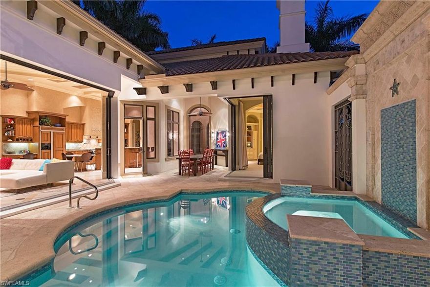 Magnificent 4 Bed + Den/4.5 bath estate just blocks from the beach. When you walk through the Cantera front doorway you enter into a timeless domicile that is exquisitely refined with world class features and finishes. Features include marble flooring, stone column archways, beautiful foyer, French doors, wet bar, granite countertops, volume/coffered ceilings, impact windows, extensive millwork and stonework throughout, and much more! Gourmet kitchen includes granite countertops, island with sink and storage, pot filler, refrigerated drawer in the island, warming drawer, ice maker, convection microwave oven and wine cooler. In addition to a chef's dream kitchen, there is an outdoor kitchen with a grill and sink to be able to entertain guests poolside. Location is still king and this location is among Naples' finest. Just blocks to the beach as well as within walking distance to famed 3rd Street and 5th Avenue dining and shopping.

Bonus: Rental income in place. Perfect for investor or second home buyer who wants to offset carry cost.