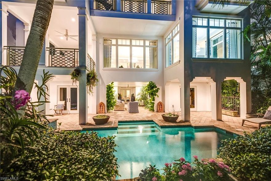 The enclave of Naples Casamore with private gated beach access embodies the best of Naples amenity-rich living. Streaming with natural light, this like-new residence offers Gulf views, 12’ ceilings with open plan, sophisticated surfaces, lighting, fixtures and finishing touches. Chef's delight kitchen with Wolf gas stove top, Sub-Zero, Bosch, EuroCave appliances, Brookhaven cabinetry. Relaxing covered terrace with gas fireplace, built-in grill. Spacious master suite with dual bathrooms, custom walk-in closets. 4 en-suite bedrooms, 5 full and 1 half baths. Private elevator. Sunset views from the rooftop observation deck. 4 car garage. Lush private retreat with in-ground pool, raised spa, landscape lighting, outdoor covered living area. Includes two private boat slips: 17,000 lb. boat lift and a 7,000 lb. platform for jet skis. Stofft Cooney design & BCB steel-reinforced concrete construction with elevated slab and deck, high-performance impact resistant Andersen windows, impact rated garage doors and so much more. Just 12 detached, pet-friendly homes that include landscaping, pool service and many maintenance items as part of the lifestyle. A happy place.