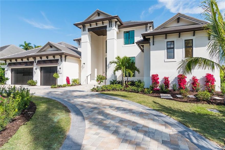 Designed for today’s Southwest Florida waterfront lifestyle, this newly constructed luxury home is located in Aqualane Shores on the broad waters of Flamingo Cove. Fully furnished with exceptional quality workmanship and materials throughout. Sophisticated, Classic and Transitional. Enter a tall foyer into a spacious and bright living area perfect for entertaining in style. Featuring 5 Bedrooms + study with ground floor master and guest en-suite, chef’s kitchen with large island, butler’s pantry, climate controlled wine cellar, 2 laundry rooms, private elevator, 2 fireplaces, 2nd level living area and covered balcony, summer kitchen, roll-down screens and hurricane shutters, large covered outdoor area, zero infinity pool, 3 car garage, full smart home technology wired for security, music, shades and lights and room for a generator all secured within this 2 story concrete block construction home. A boater's paradise with a new sea wall, 100 feet of water frontage and easy access to the Naples Bay with no bridges. Close proximity to the famous Naples' beaches and the celebrated Third Street Shops and Dining.