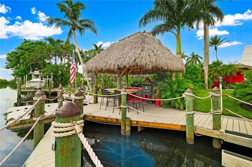 THOUGHTFULLY REPRICED TO ELEVATE AN EXCEPTIONAL WATERFRONT LIFESTYLE, FEATURING THE RARE BENEFIT OF A PRIVATE CASITA.  Enjoy quick Gulf access on deep water in this remarkable waterfront home.  What appears modest from the street unfolds into a stunning, unexpectedly spacious and beautifully designed interior, while the rear waterfront setting delivers a.truly breathtaking experience, and will leave you speechless!  Income potential! Live in one and rent the other, or use as a guest home. A rare waterfront gem in coveted Yacht Club Colony where lifestyle, luxury, and income potential all come together. This area is the new HOT SPOT of Fort Myers!  The main residence offers 4 bedrooms, 3 baths, and a chef’s kitchen with abundant storage and pantry, while the fully private (Casita) guest home includes 1 bedroom, living room, dining, galley kitchen, full bath, and laundry, separate parking area and entry—ideal for in-laws, Airbnb, Guests, or rentals. Both homes are newly and fully updated including Beautiful Plantation shutters throughout!  
Step outside to your tropical oasis with a sparkling saltwater pool and screened lanai, a 12x16 tiki hut ready for entertaining, and winding garden paths through lush landscaping. A true fruit lover’s paradise, the property boasts mango trees, coconut, guava, lime, orange, avocado, banana, papaya, starfruit, passion fruit, dragon fruit, macadamia, and even five thriving monstera deliciosa—harvest fresh fruit year-round! Privacy abounds with no visible neighbors, just nature and tranquility.

Upgrades include a whole-house generator with 500-gallon propane tank, 48” custom flood-barrier system, ADT security in both homes.
This home boasts brand-new appliances, two new water heaters, updated ductwork and insulation, RV/EV hookups, and RV blackwater drain, welder circuit, and more. The 250’ concrete bulkhead in excellent condition, and the synthetic no-rot decking and wood pylons are one yr old which hosts two amazing boat lifts (16,000 & 11,000 lbs). along with the EZ Dock jet ski ramp for two watercraft. There is both electric and water at the dock. 
This home sits on direct access on a deepwater canal—just a few minutes to open water with no bridges. Explore mangrove-lined waterways, watch dolphin and manatee, beautiful birds, and enjoy Florida wildlife right from your backyard. Just Minutes from Cape Coral and downtown Fort Myers and I-75, with convenient access to two nearby airports, this home blends privacy with accessibility.  Waterfront restaurants and popular boating destinations are only a short boat ride away. Access to both sides of the Ocean.  Don’t miss your chance to own one of Yacht Club Colony's  most extraordinary private deepwater canal-front properties—a rare blend of elegance, function, and true Florida lifestyle. If you're looking to step right into your new home, without worry, this is the one. Furniture and Boat negotiable.