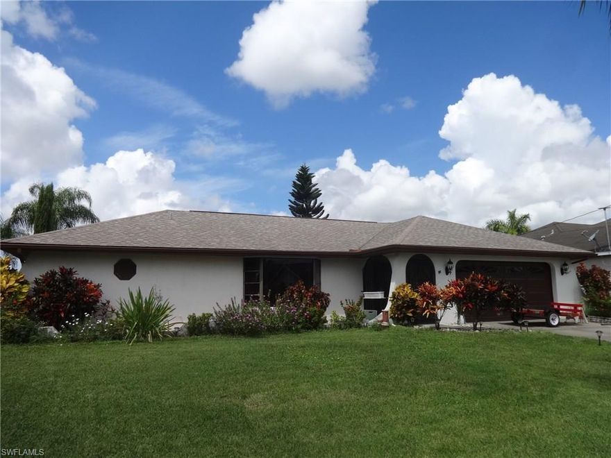 UPDATED GULF ACCESS POOL HOME IN LOVELY SE CAPE NEIGHBORHOOD. Not many of these left in this price range. Spacious 3 bedroom home with split bedroom plan, formal living and dining as well as separate family room. Upgraded Kitchen features GRANITE, WOOD CABINETS and STAINLESS APPLIANCES. Master has separate tub and shower as well as his and hers sinks with upgraded fixtures and GRANITE. Large lanai features tiled lanain, as well as pass-through bar for entertaining and a new hot tub.  Large pool area, with privacy wall, and spa overlook your waterfront. Nice canal with cocktail dock ready for boating, fishing, or just sipping a margarita. One bridge out to the river. Double garage offers built in storage. Front has screened entry. CITY WATER AND SEWER in and paid.  FENCED. Newer roof and resurfaced pool. Near restaurants, shops, Yacht Club Beach and more. Must see.