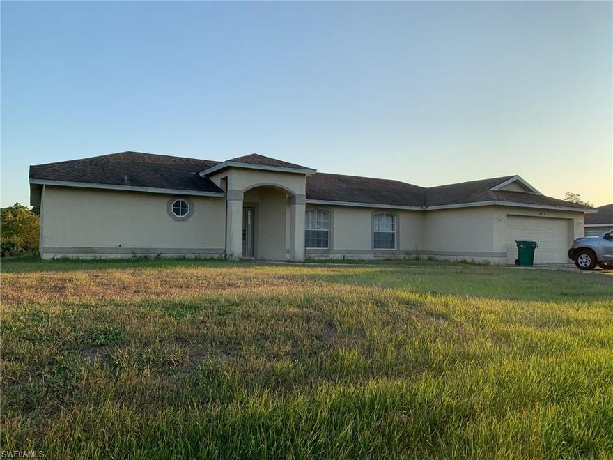 Nice 3/2 southern exposure home on 2.25 Acres sold turnkey furnished as is where is Formal Living room , Formal Dining room, Family room and eat in kitchen. screen lanai, Laundry room, 2 car garage. High end window treatments throughout the house with small pond in back of property.