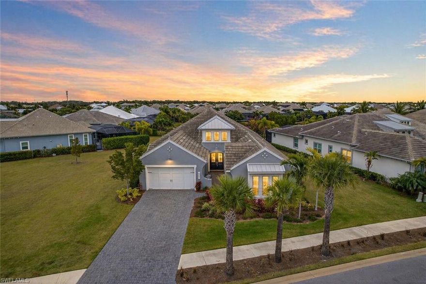 Indoor. Outdoor. Effortless. Tucked inside the prestigious, award-winning Isles of Collier Preserve, this Jasmine Grande model sits on a rare 0.43-acre lakefront parcel, one of the larger lots in the community, offering extra space, privacy, and a long, extended driveway that immediately sets it apart.

The outdoor living is the headline: a custom 2024 aftermarket pool and spa, designed far beyond standard builder offerings. Featuring marble flagstone decking and an expanded patio, pool, and panoramic screen enclosure, this space delivers a true resort-style setting for entertaining, relaxing, and fully embracing the Florida lifestyle.

Inside, a breathtaking great room showcases soaring ceilings and wall-to-wall 10-foot disappearing sliders, seamlessly blending indoor and outdoor living. Tile flooring runs throughout the main living areas, leading into a chef’s kitchen with an oversized island, dual sinks, custom cabinetry, and a striking tile backsplash, designed for both everyday living and hosting.

The primary suite offers a private retreat with a nice window sitting area, dual walk-in closets, and a spa-style bath with soaking tub, separate vanities, and a walk-in shower. A split-bedroom floor plan provides comfort and privacy with an additional en-suite bedroom, third bedroom, and a versatile den. Nearly 3,000 sq ft under air offers flexibility and function. Additional highlights include impact-rated windows and doors for peace of mind.

Isles of Collier Preserve completes the experience with unmatched amenities, including a spectacular resort pool and spa, lap pool, poolside Bar & Grill, state-of-the-art fitness center, tennis and pickleball, kayaking and paddleboarding, catch-and-release fishing, and miles of scenic hiking and biking trails. And when you’re ready to lean into the Naples lifestyle, you’re just minutes from downtown dining, boutique shopping, vibrant culture, and the sugar-sand beaches. This is truly one of the most special properties available, and a must-see!