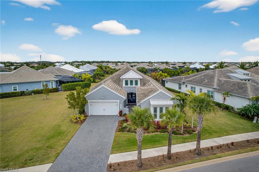 Indoor. Outdoor. Effortless.

Tucked inside the prestigious, award-winning Isles of Collier Preserve, this furnished coastal-style home lives like a private resort, set on one of the community’s largest parcels at 0.43 acres with tranquil lake views and a stunning custom aftermarket pool and spa that turns the backyard into a true destination. It’s a rare combination of extra land, extra breathing room, and elevated indoor-outdoor living in one of Naples’ most sought-after communities.

Inside, the layout is designed for effortless Florida living: an open-concept great room and dining space made for gathering, a dedicated office for quiet focus, and a gourmet chef’s kitchen that keeps everyone connected, from casual mornings to evenings in. Three spacious bedrooms each offer their own luxurious ensuite bath, creating comfort and privacy for family and guests. The home also offers versatile den and nearly 3000 sq ft under air.

Step outside and you’ll feel the difference: expansive outdoor space, peaceful water views, and a resort-style setting centered around that showstopping newer pool, perfect for lounging, entertaining, and living outside as much as you live in.

Isles of Collier Preserve completes the experience with unmatched amenities, including a spectacular resort pool and spa, lap pool, poolside Bar & Grill, state-of-the-art fitness center, tennis and pickleball, kayaking and paddleboarding, catch-and-release fishing, and miles of scenic hiking and biking trails. And when you’re ready to lean into the Naples lifestyle, you’re just minutes to downtown dining, boutique shopping, vibrant culture, and the sugar-sand beaches