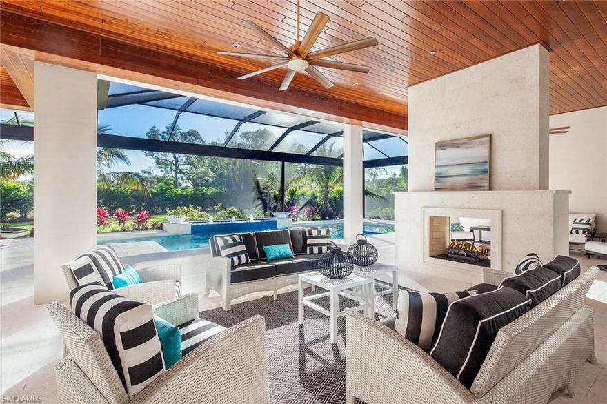 The masterful architectural plan provides for one level living in this just completed classically designed estate home situated on an expansive acre lot in Pine Ridge Estates. Entering through lovely double doors, the grand open living and kitchen space is accented by soaring ceilings highlighted with inset beams and custom detailing featuring a large fireplace and Floor-to-ceiling pocket sliding doors creating the perfect entrance to the generous outdoor area. The outdoor living space is defined by three separate conversation areas, a see-through fireplace and outdoor kitchen. The pool is highlighted with two water and fire features and a true outside firepit is located on the lanai as well. The kitchen boasts double islands, high end chefs appliances and a butler’s pantry. In addition to the 4 bedroom guest suites, the master bedroom wing not only has his and her closets but his and her offices. Pine Ridge is located in north Naples a five minute drive to pristine beaches, fine dining and shopping at Waterside Shops and Mercato and entertainment offerings of Artis-Naples.  Leaseback options and certain trade opportunities would be favorably considered by owner.