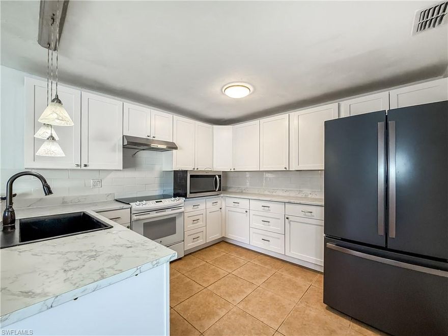 Welcome to Royal Woods! This charming attached residence offers just over 1,000 square feet with 2 bedrooms and 2 bathrooms, providing a great opportunity for a buyer to add their own personal touch. The home features an updated kitchen, a comfortable layout, and a spacious patio perfect for relaxing or entertaining. As a desirable end unit, you’ll enjoy additional side space and a bit more privacy than most. Move-in ready and full of potential, this is a wonderful chance to create your own slice of Southwest Florida living in a well-located community.